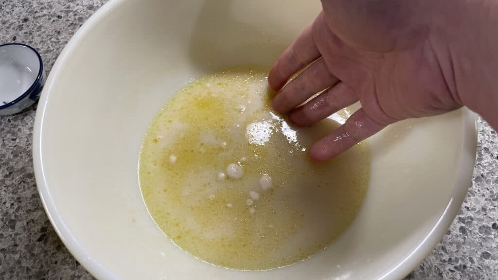 stirring salt and flour into dough mixture